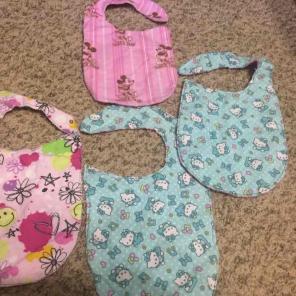 Lot of 4 girl style bibs/burp cloths