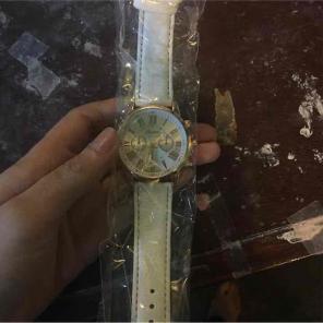 white and gold watch