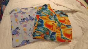 2 small Disney scrub jackets