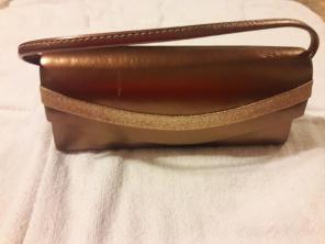 Gold colored crossbody bag