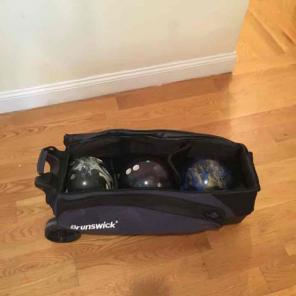 Four Bowling Balls and Tournament Roller