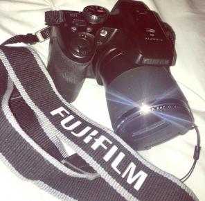 Black Fujifilm dslr camera