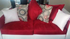 Sofa and loveseat with throw pillows