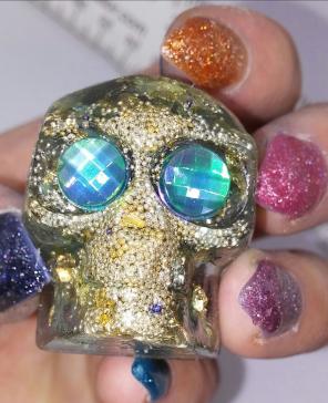 Green rhinestone & gold leaf resin skull