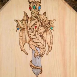 Wood burned dragon sword art