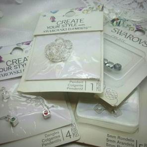 4 packages of swarovski beads