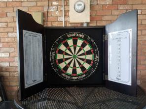 Dartboard and cabinet