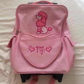 Girls Pink rolling wheel school backpack