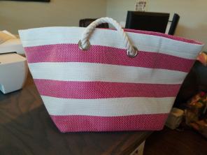 Pink and white straw tote or storage bin