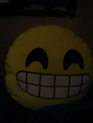 Smiling emoji pillow