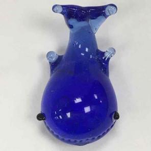 Inch and a half whale figurine.