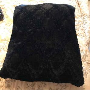 Black furry pillow