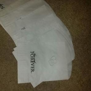 stack of hand stamp wedding favor bags
