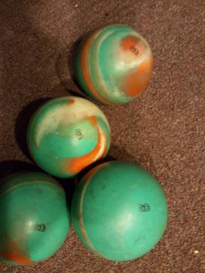 Set of 4 candlepin bowling balls.
