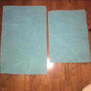Turquoise bath rugs on hold
