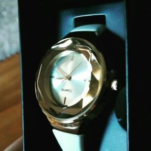 Avon quartz white band watch