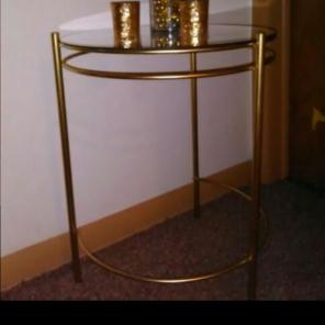 Round gold table with glass top