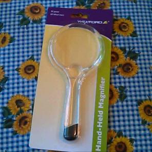 Hand held magnifier