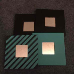 Four separate teal and black mirrors