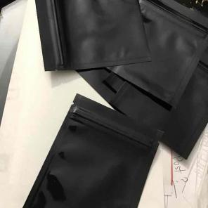 25 black bags. Jewelry.Foil like inside