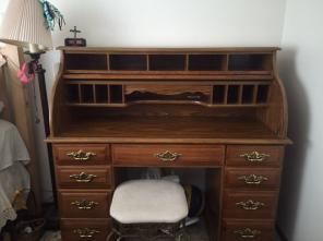 Brown wooden roll top pedestal desk