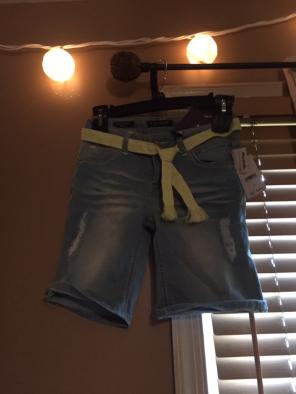 A. Denim Pair Of Pants With A Belt