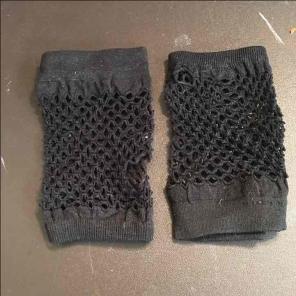 pair of fingerless gloves with holes