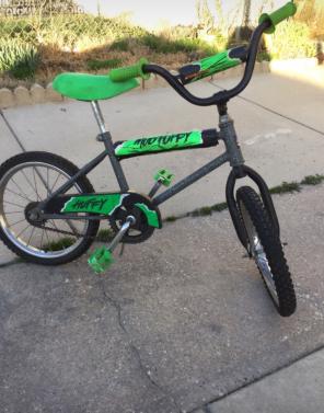 Green and black huffy bicycle For Kids