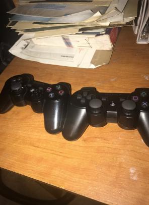 Both Black PS3 Controllers