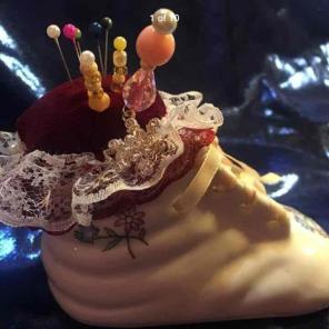 Pin cushion in baby shoe