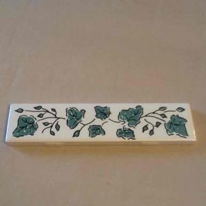 Piece of tile with ivy