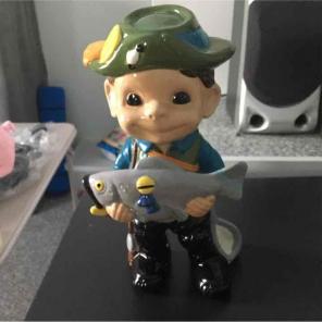 Homemade golfer/fisherman figurine