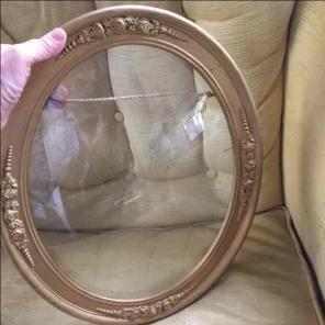 Ornate old gold frame with convex glass