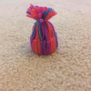 Cardboard and string mini hat