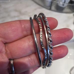 FOUR STERLING SILVER BANGLES