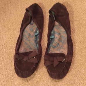 Brown suede moccasin flats with bow