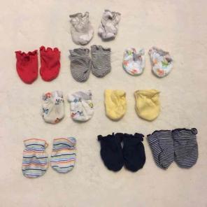 9 pair of Baby mittens