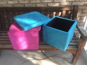 two pink and blue suede storage chairs