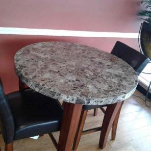 Marble top table with four bar stools