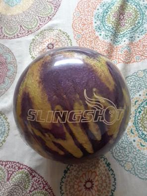 Brunswick purple and gold bowling ball
