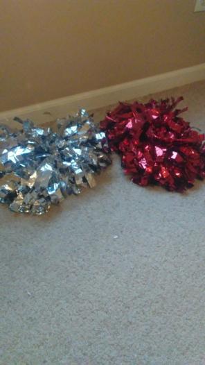Matching gray and red pom poms