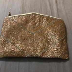 Super cute gold LuLus clutch