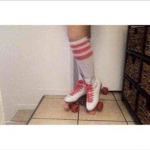 Pink and white roller skates