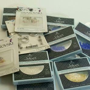 12 packages of swarovski beads