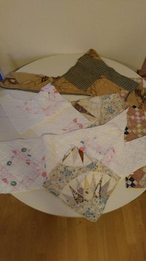 Pieces of vintage quilts