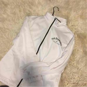 Brand new SF zip up white