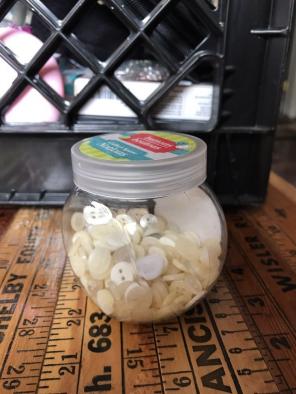 Jar Of Cream And White Buttons