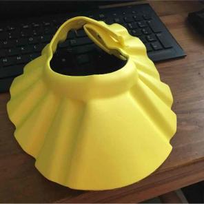 Yellow foam baby shower cap