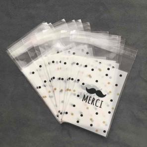 24 Merci Mustache small white Cello bags