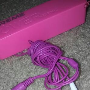Pink portable charger/purple headphones